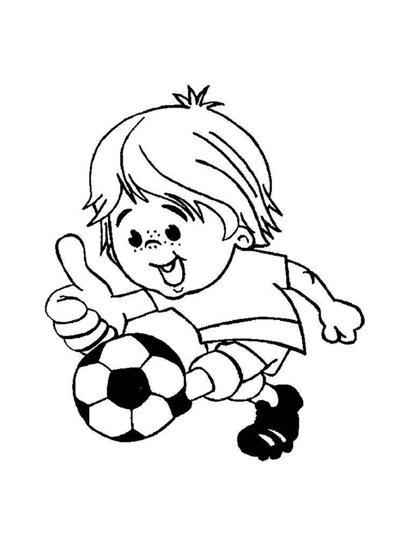   Un enfant joue au foot 