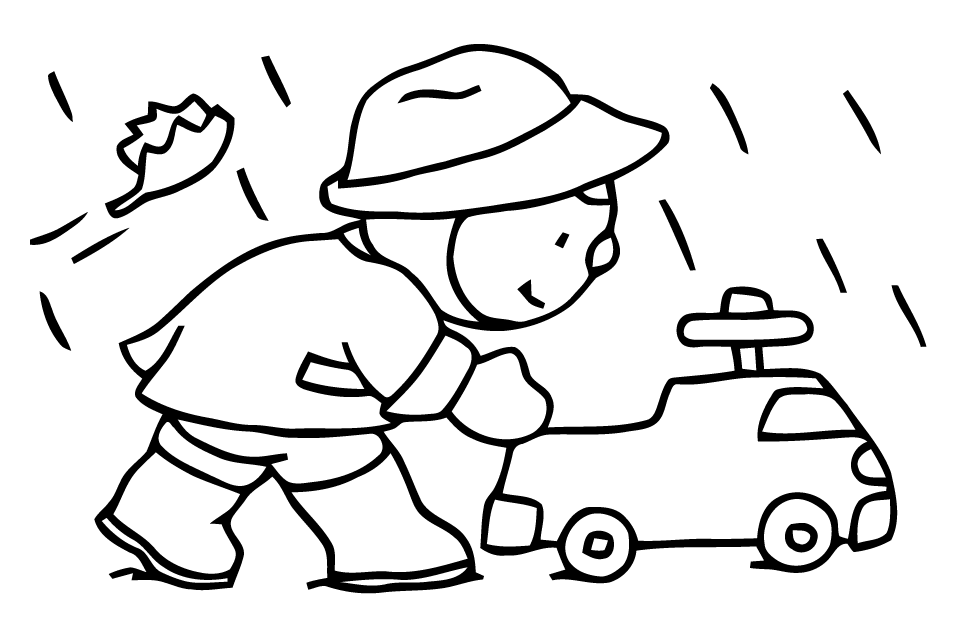   Garçon poussant une voiture jouet 