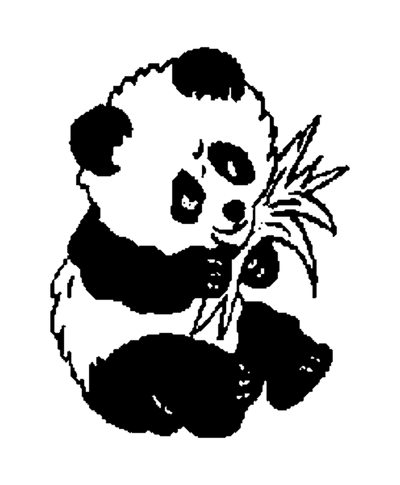 panda assis mange des feuilles