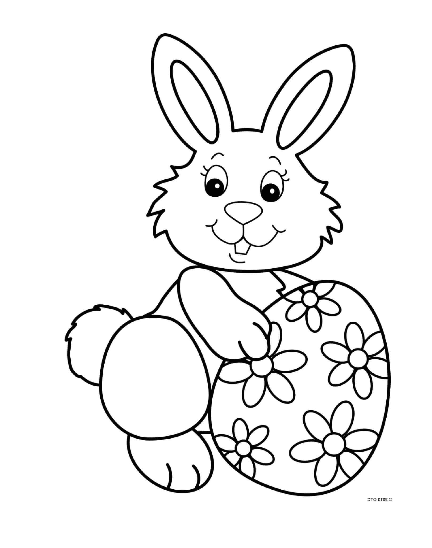 coloriage jolie lapin souriant avec un oeuf de paques motif fleurs