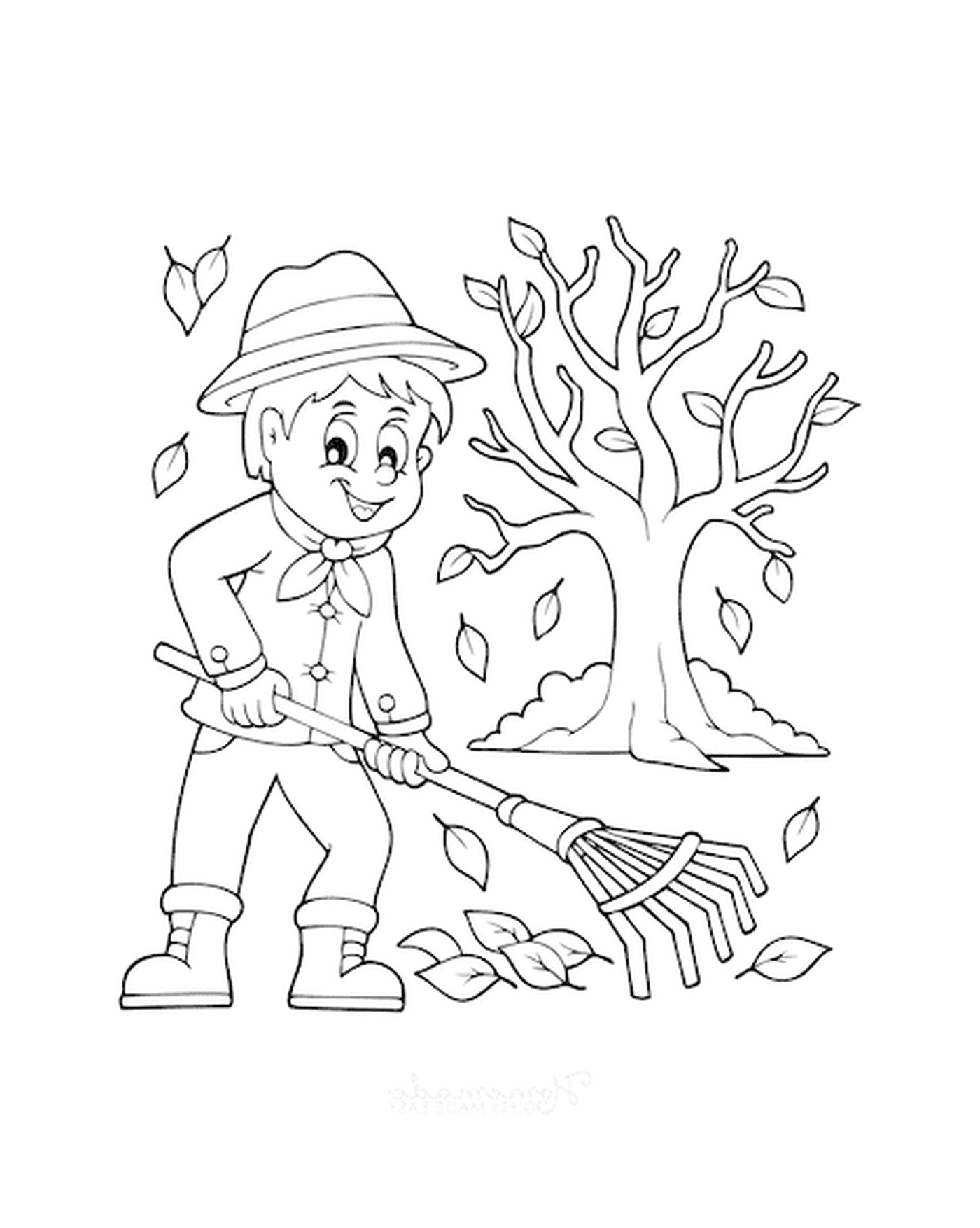   Un garçon qui ratisse les feuilles devant un arbre 