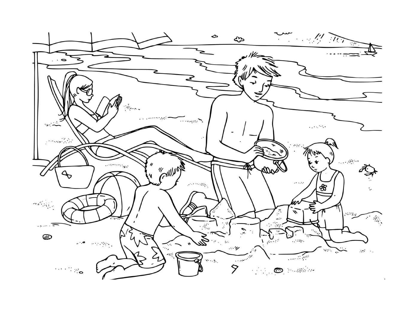   Famille s'amuse sur la plage 