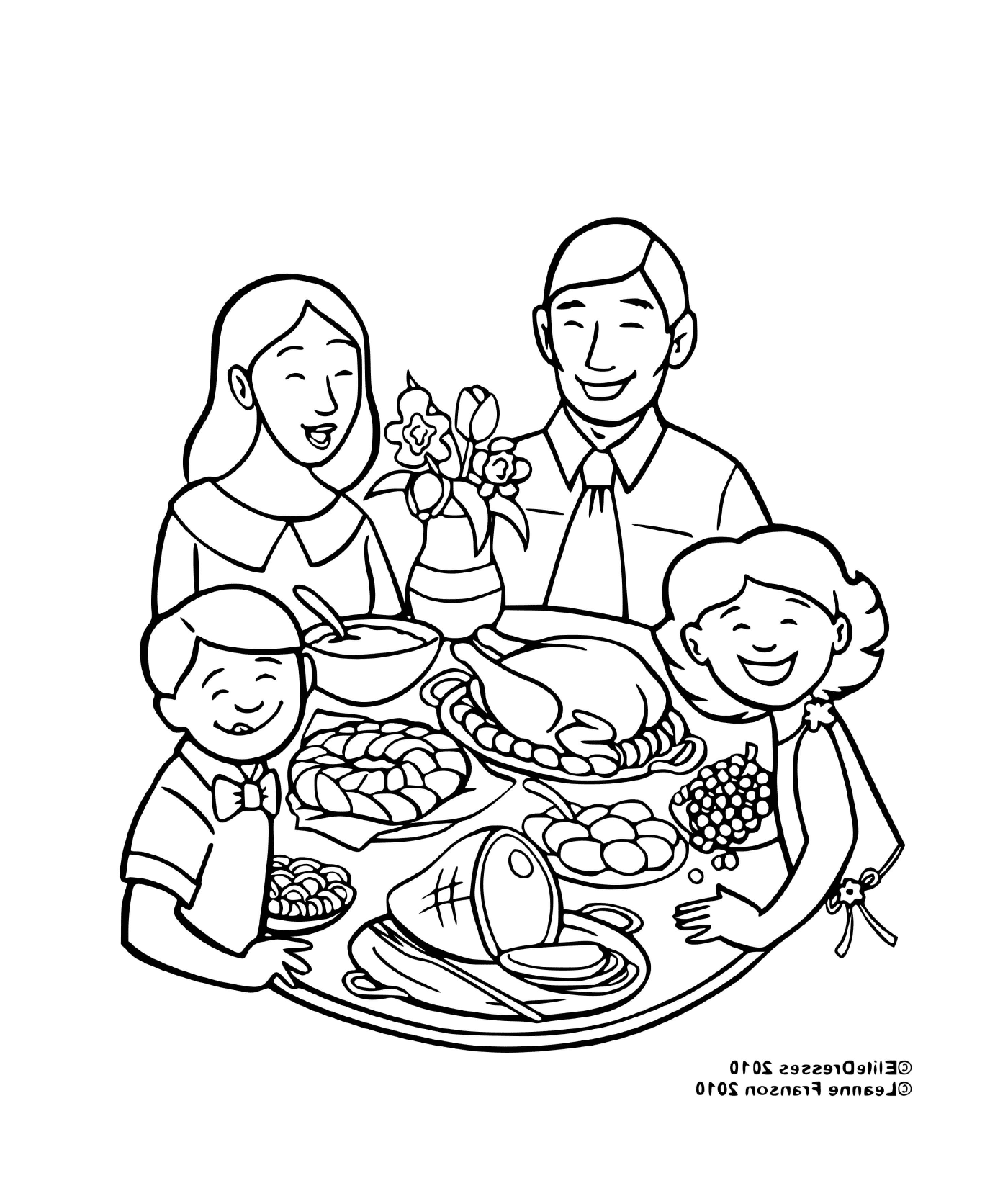   Une famille attablée pour le repas 