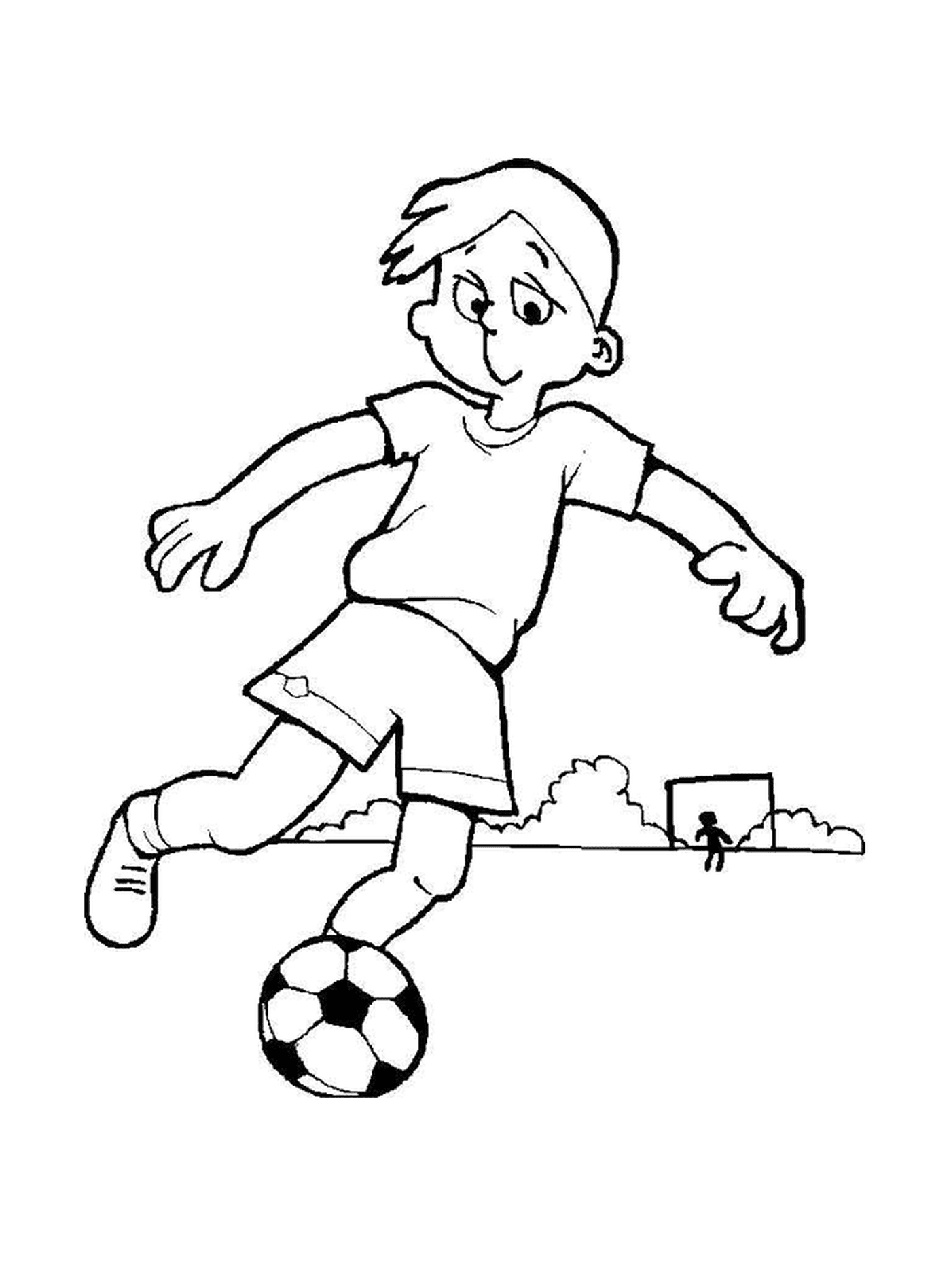   Un enfant qui joue au foot 
