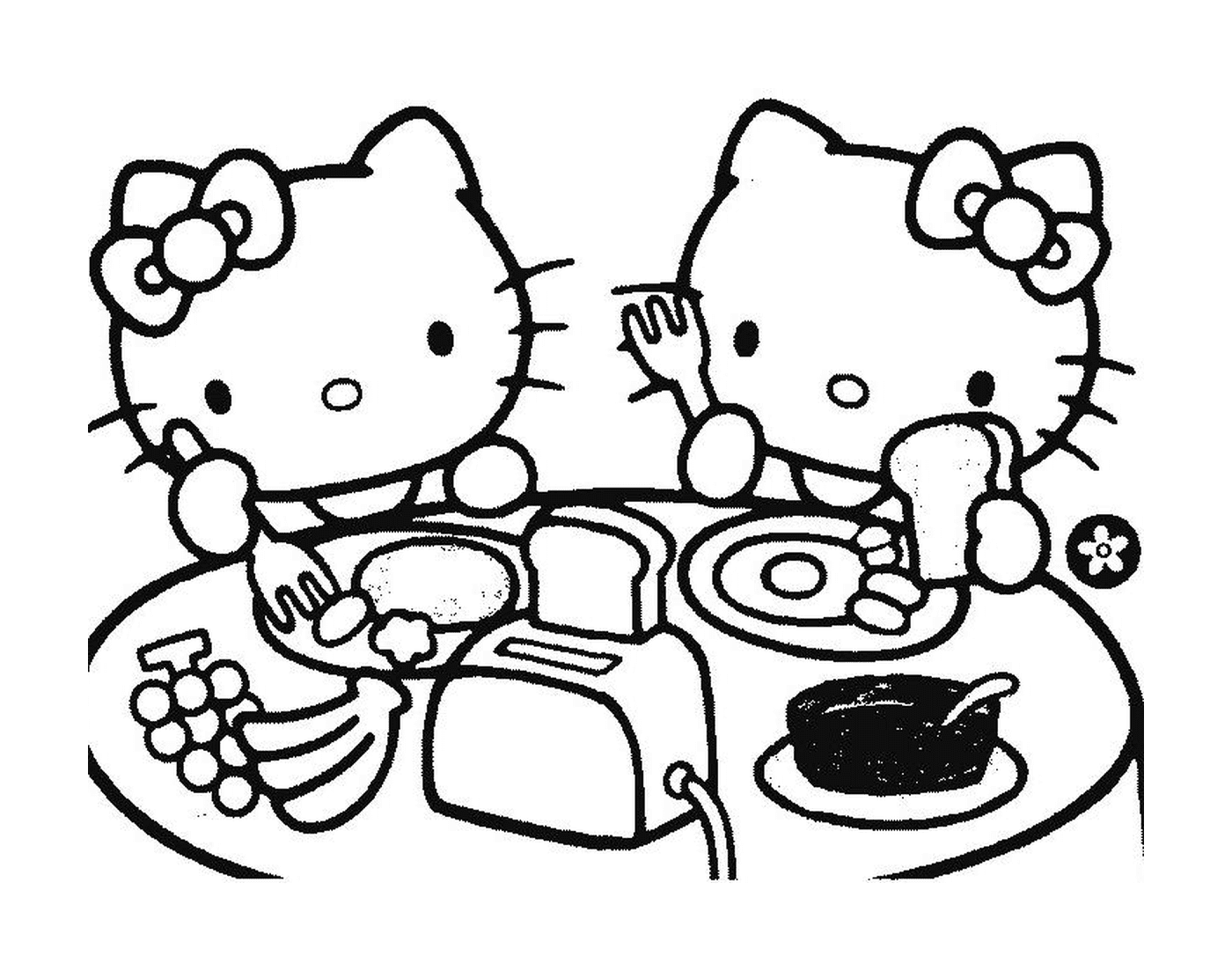   Deux Hello Kitty assises à une table 