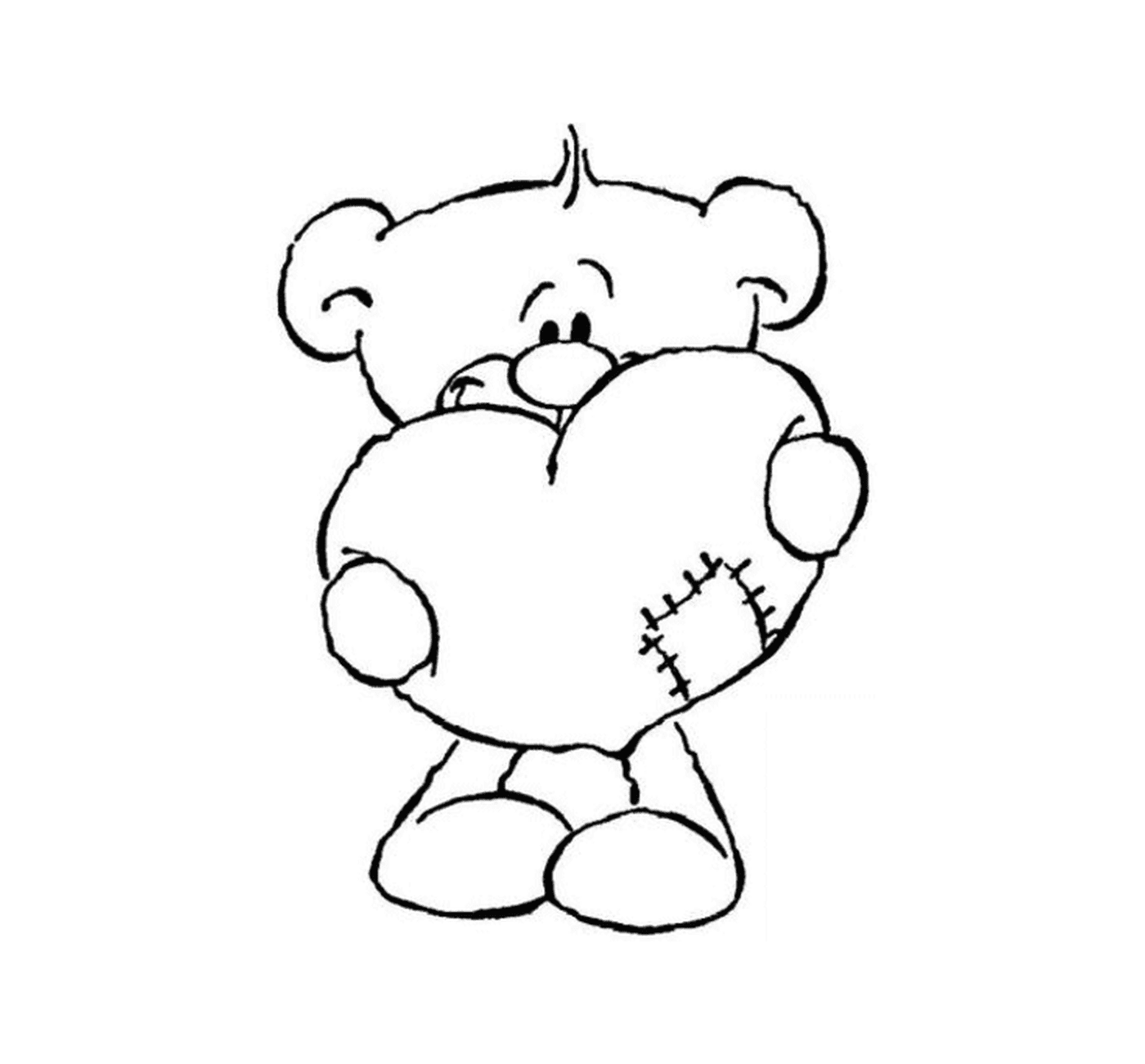   Un ours en peluche tenant un cœur dans ses mains 