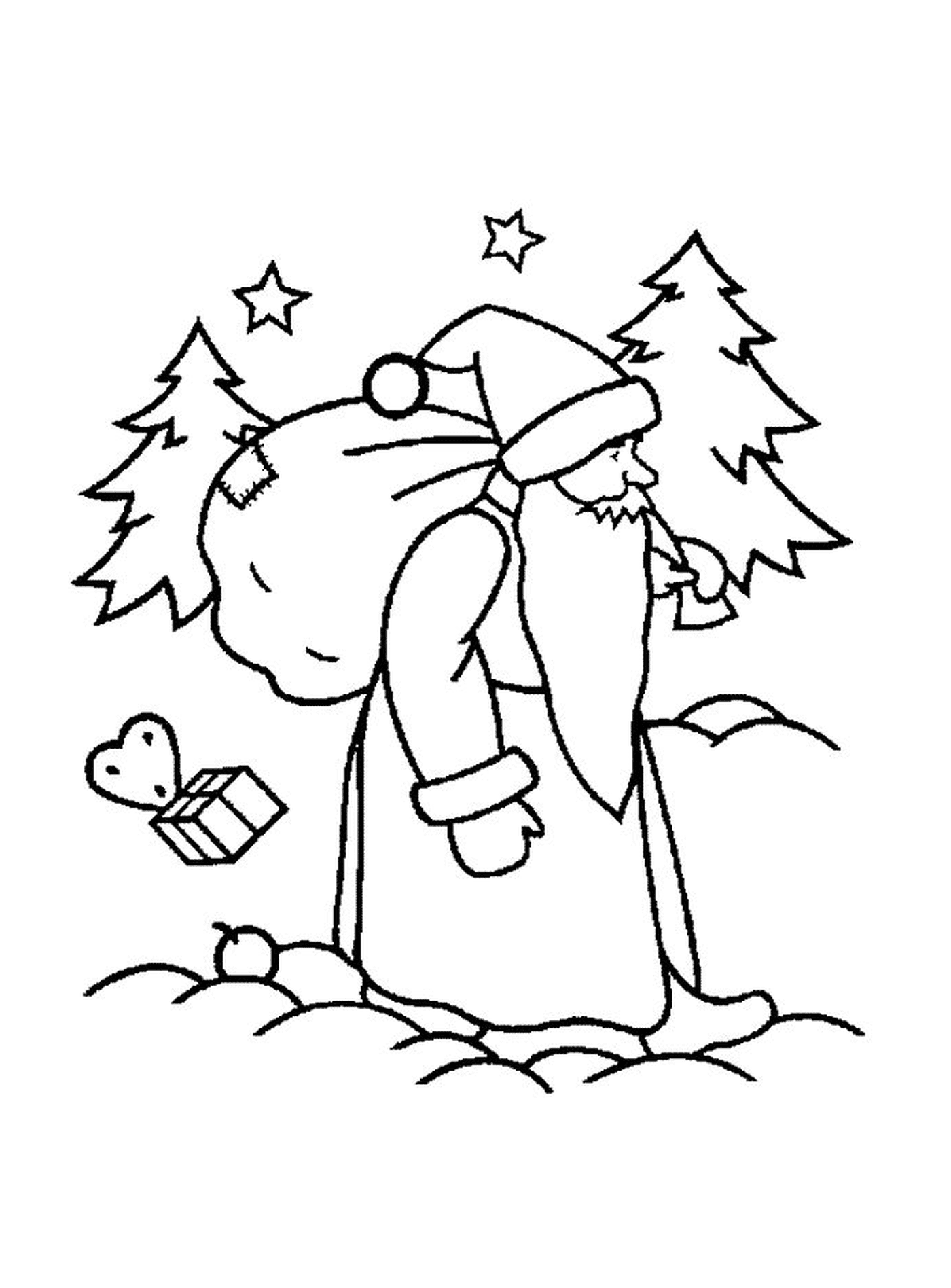   Père Noël marchant vers un sapin 
