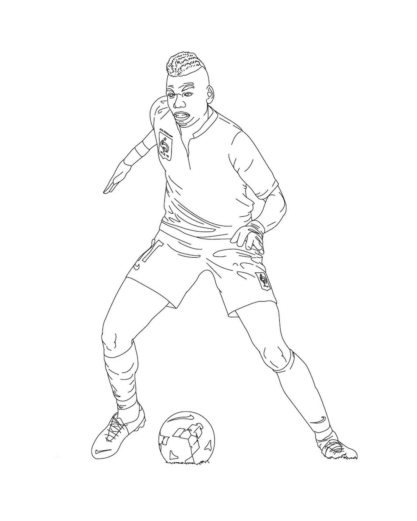   Un joueur de football donnant un coup de pied dans un ballon 