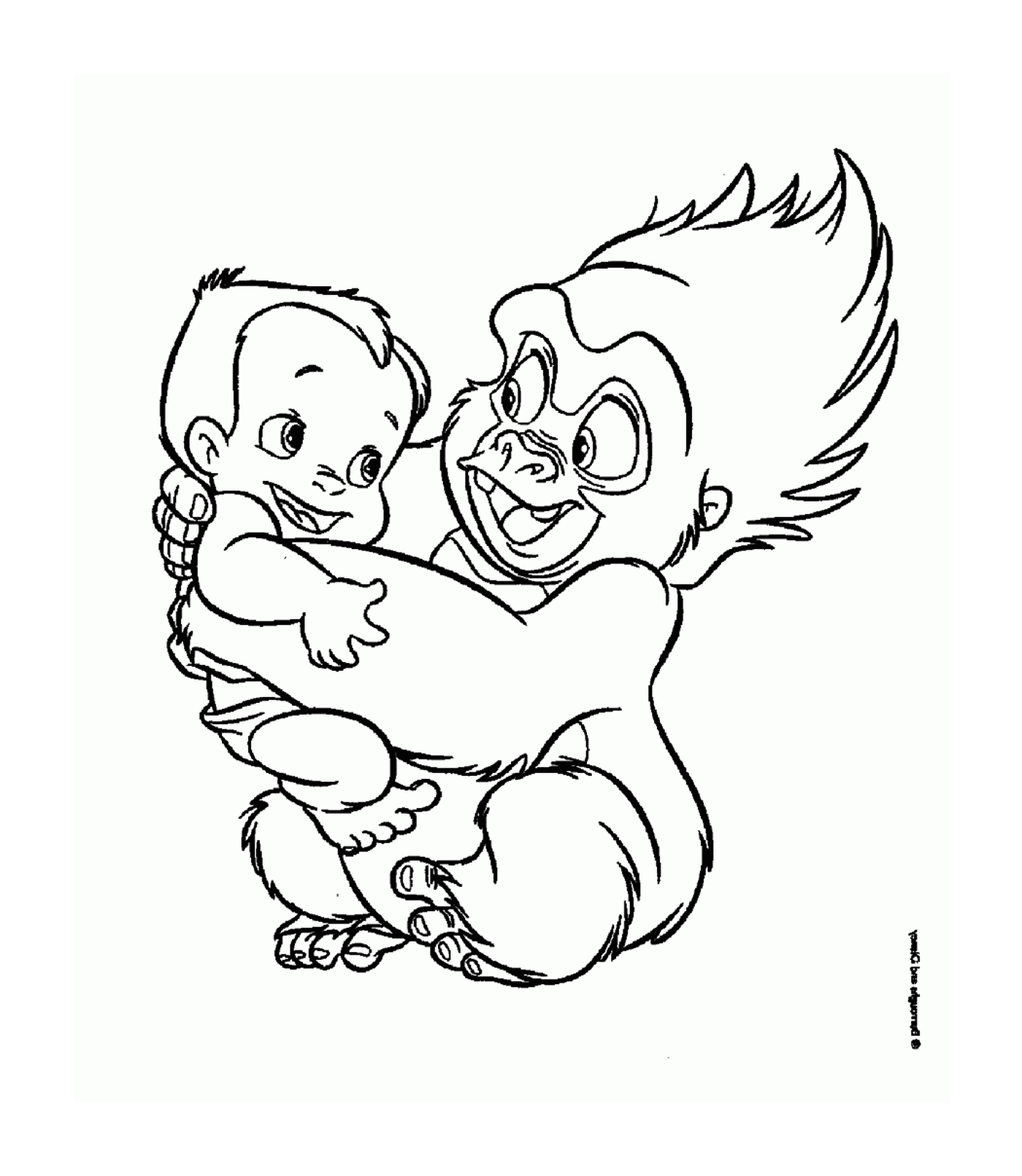   Adulte et bébé gorille se serrent dans les bras 