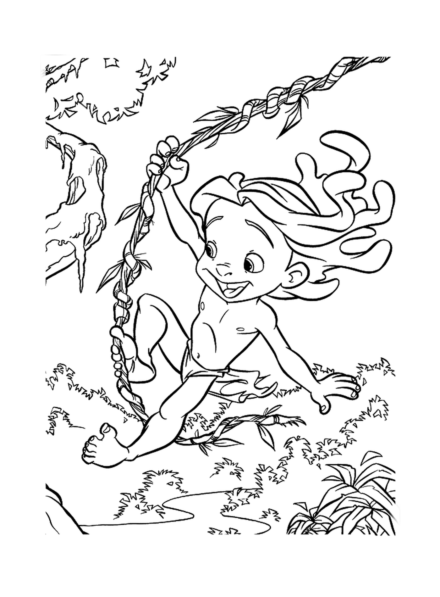   Enfant qui se balance sur une branche d'arbre 