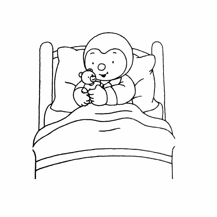   Enfant allongé dans un lit tenant un ours en peluche 