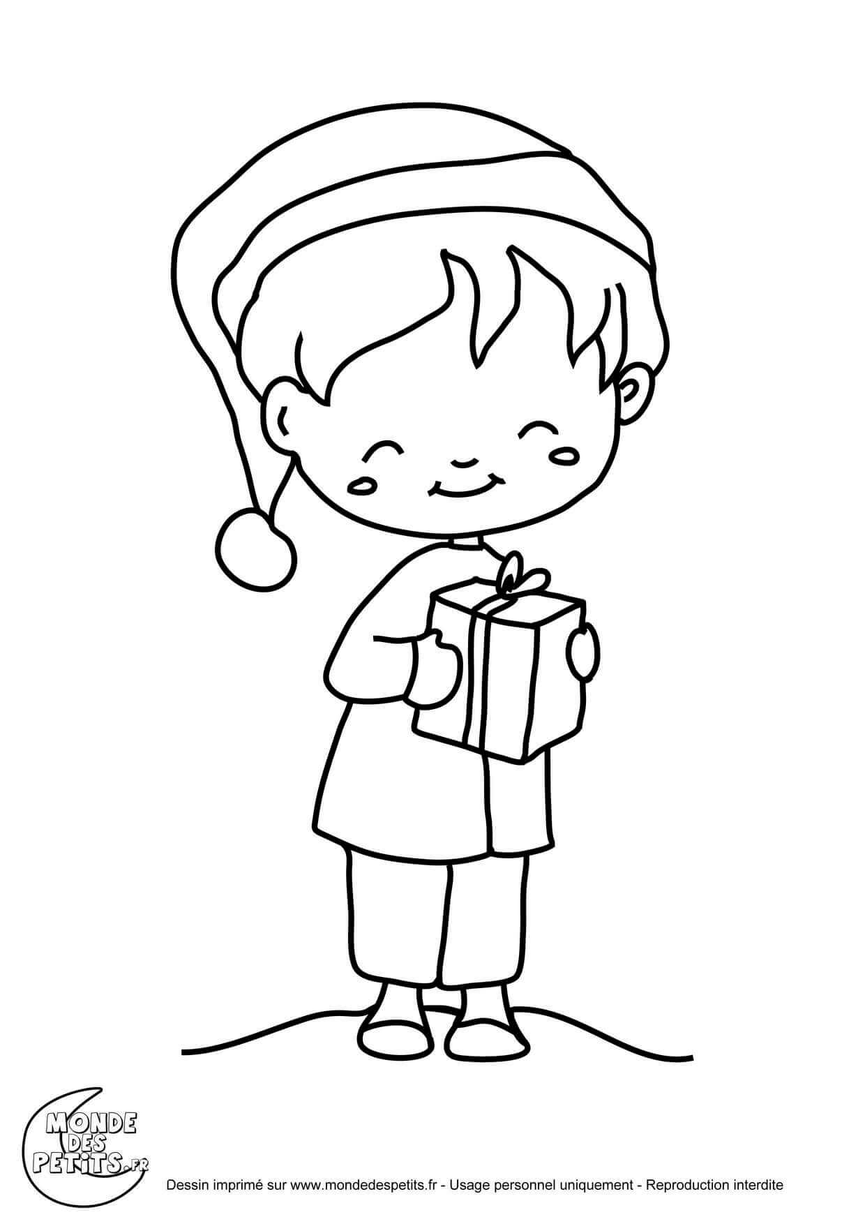   Enfant avec un cadeau de Noël 